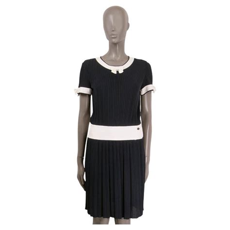 chanel mini black dress|Chanel pleated dress.